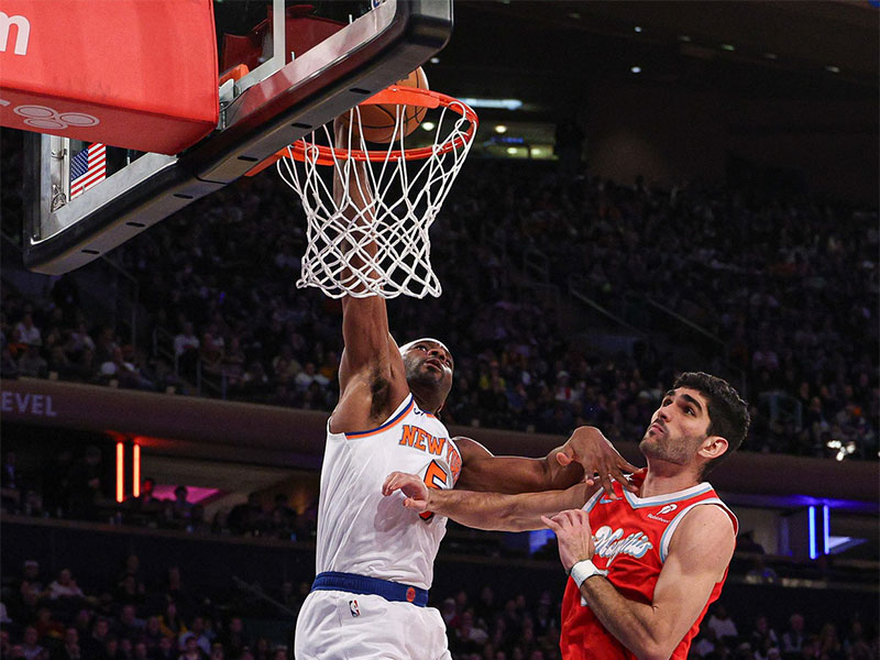 New York Knicks forward Precious Achiuwa (5) dunks the ball in front of Memphis Grizzlies forward Santi Aldama (7) during the second half at Madison Square Garden