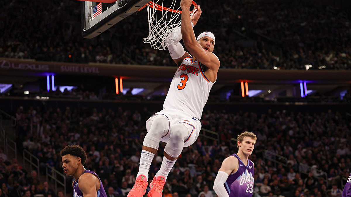 Knicks guard Josh Hart (3) hangs on the rim