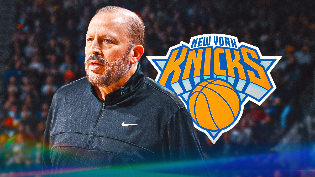 Tom Thibodeau, Knicks logo in the background.