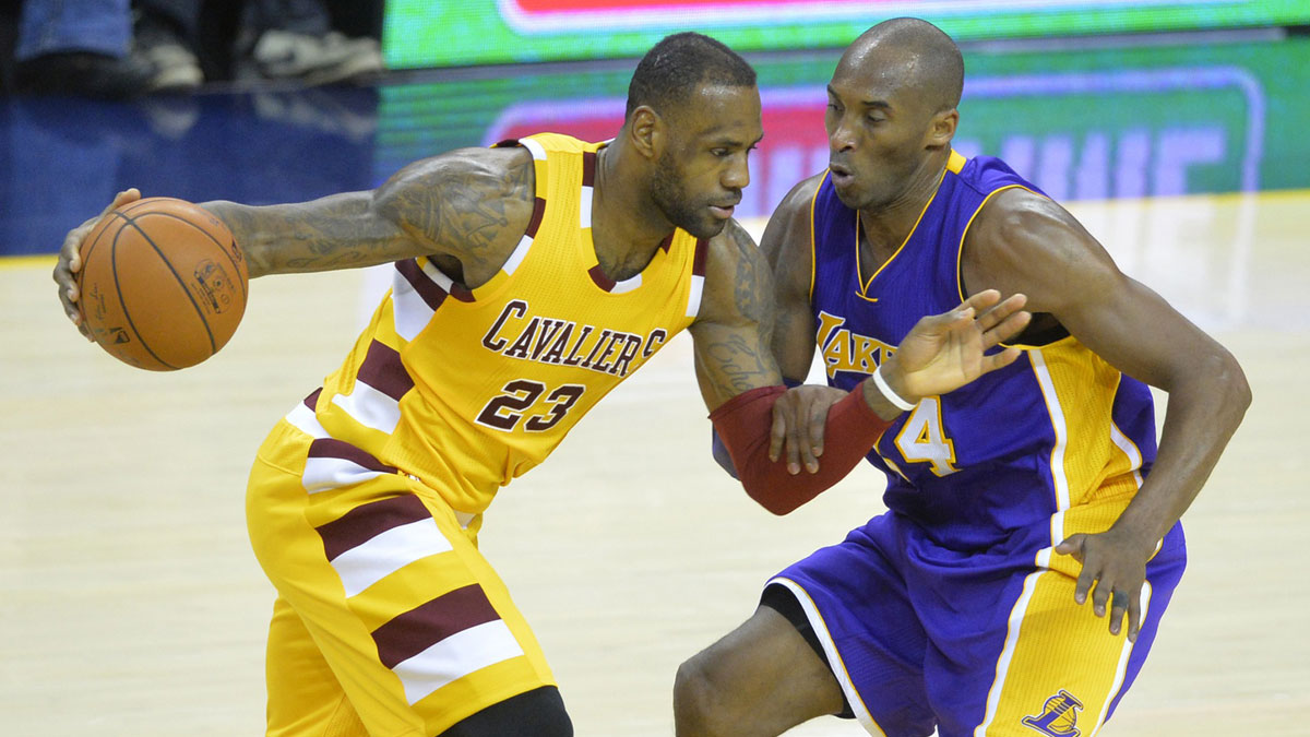 Cleveland Cavaliers forward LeBron James (23) dribbles against Los Angeles Lakers forward Kobe Bryant (24) in the fourth quarter at Quicken Loans Arena. 