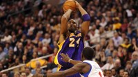 Los Angeles Lakers guard Kobe Bryant (24) shoots over the defense of Philadelphia 76ers guard Jrue Holiday (11) during the second quarter at the Wells Fargo Center.