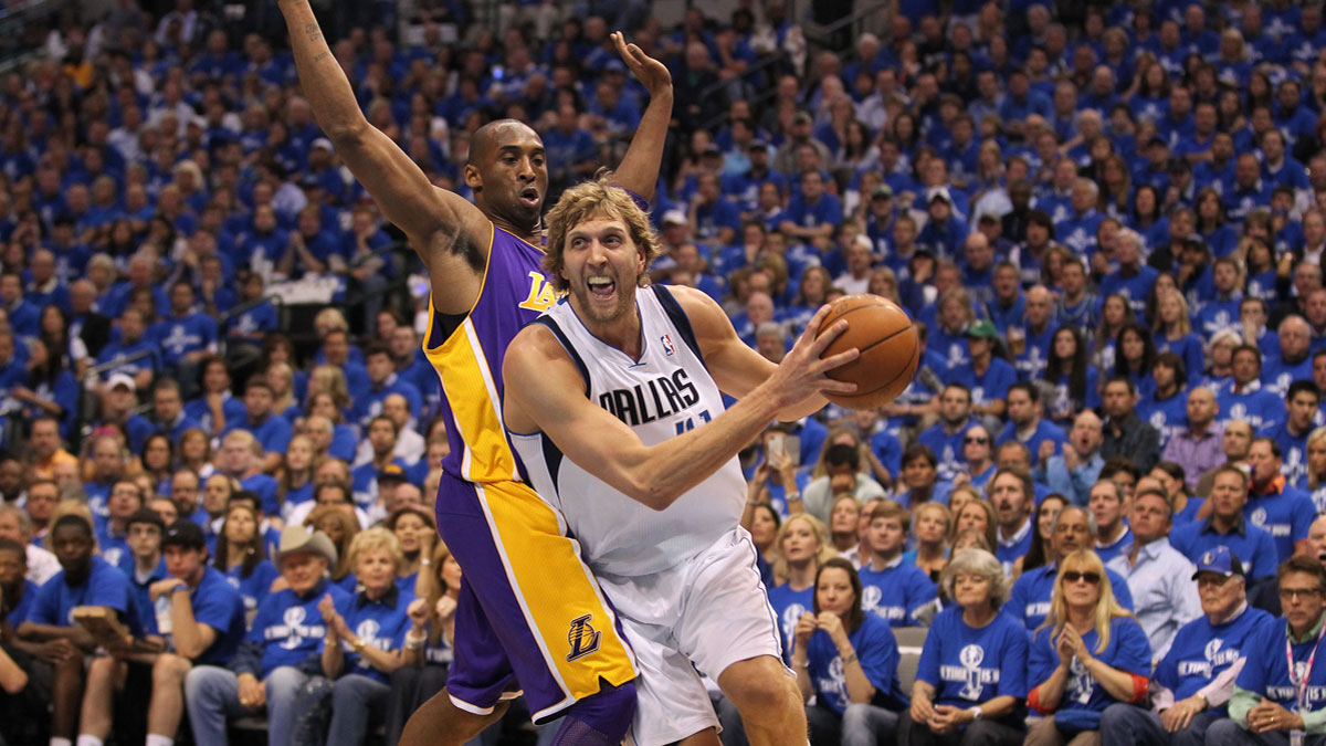 Dallas Mavericks forward Dirk Nowitzki (41) drives in the first quarter of game three against Los Angeles Lakers guard Kobe Bryant (24) of the second round of the 2011 NBA playoffs at American Airlines Center. 