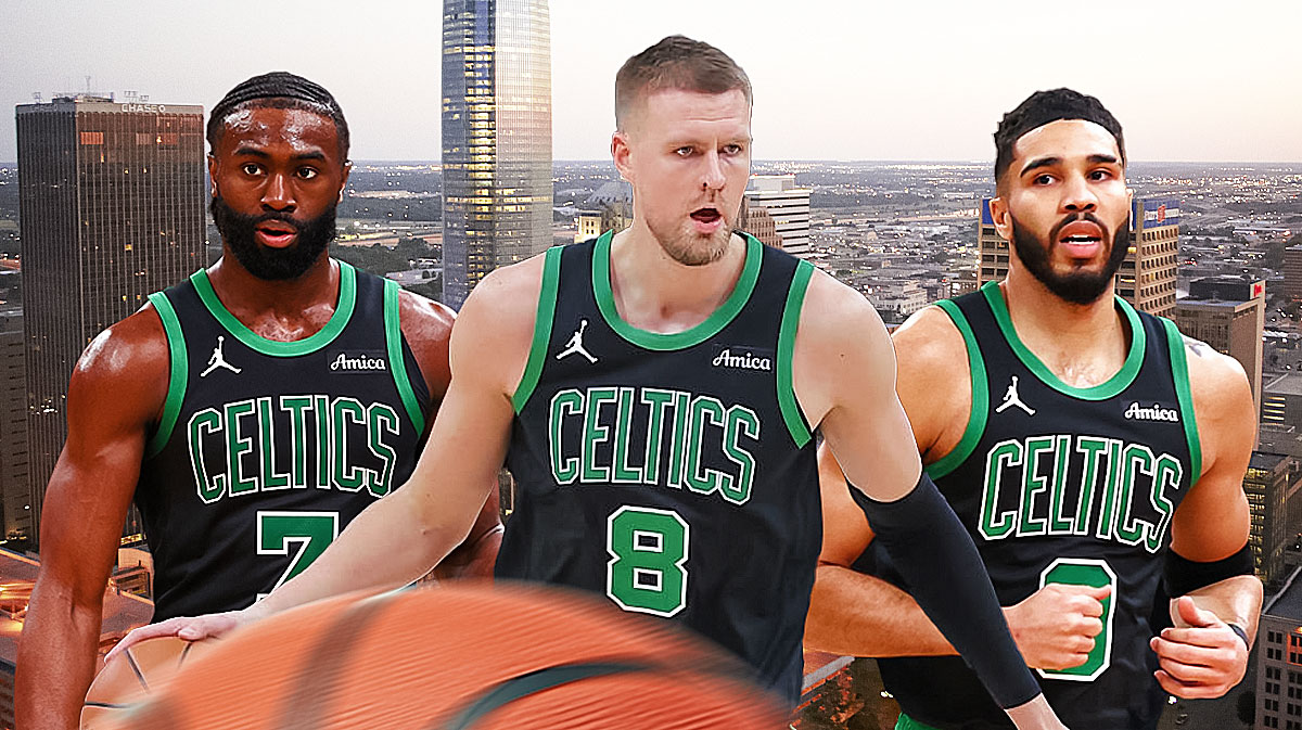 Celtics Kristaps Porzingis next to Jaylen Brown and Jayson Tatum