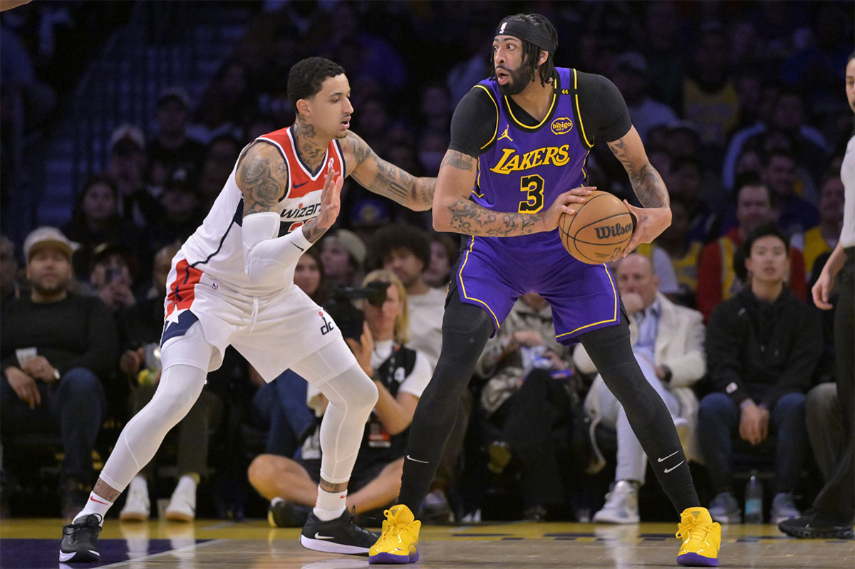 Washington Wizards forward Kyle Kuzma (33) guards Los Angeles Lakers forward Anthony Davis (3) in the first half at Crypto.com Arena.