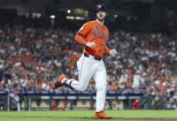 Houston Astros right fielder Kyle Tucker (30) looks towards the dugout after hitting a single during the third inning against the Los Angeles Angels at Minute Maid Park.