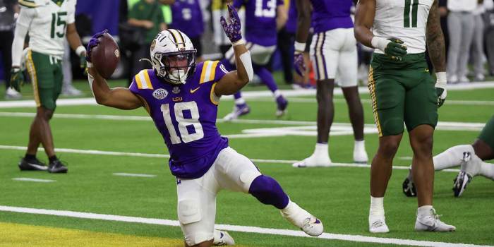 Dec 31, 2024; Houston, TX, USA; LSU Tigers running back Josh Williams (18) celebrates a touchdown against the Baylor Bears in the second half at NRG Stadium. Mandatory Credit: Thomas Shea-Imagn Images