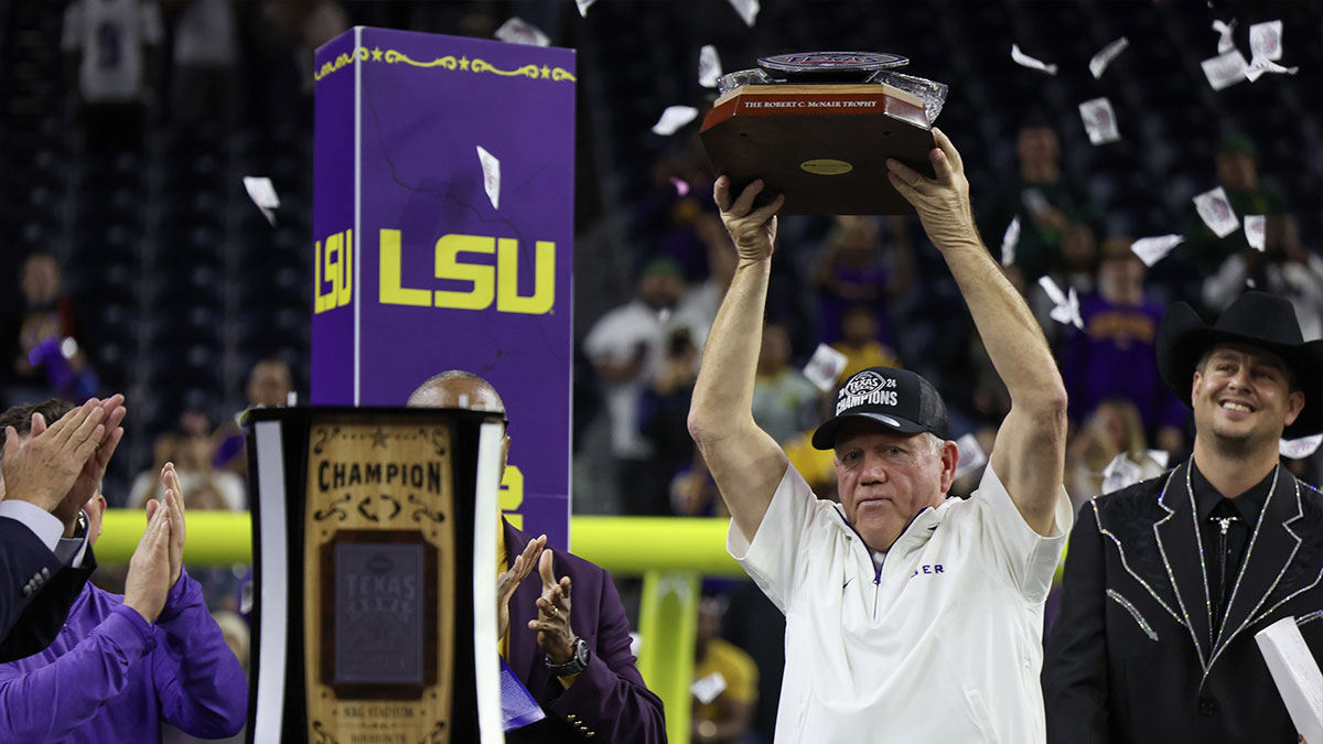 LSU Tigers head coach Brian Kelly holds up the trophy after defeating the Baylor Bears in the Kinder’s Texas Bowl in the second half at NRG Stadium.