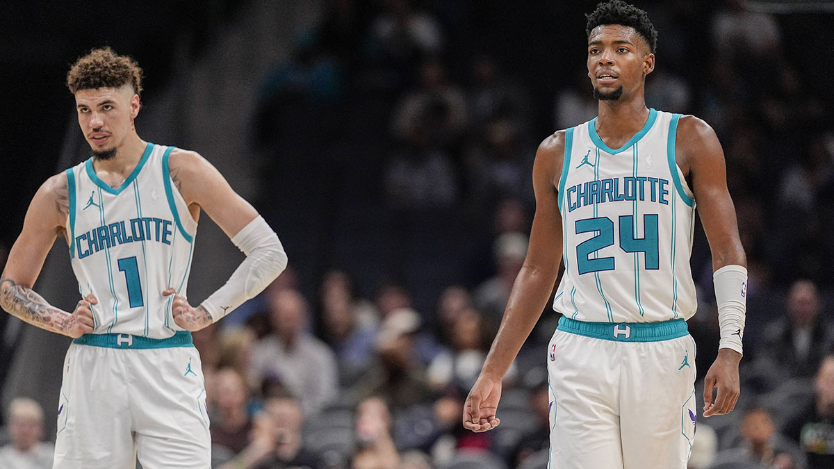 Charlotte Hornets guard LaMelo Ball (1) and forward Brandon Miller (24) at midcourt against the Miami Heat during the second half at Spectrum Center