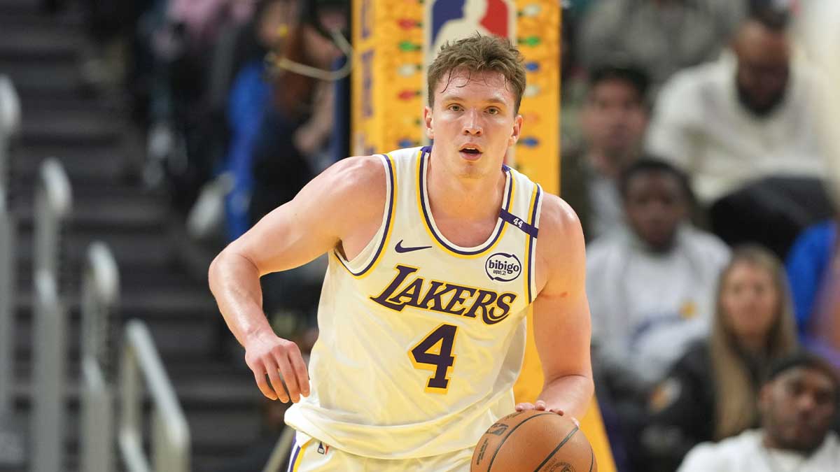 Los Angeles Lakers guard Dalton Knecht (4) dribbles against the Golden State Warriors during the second quarter at Chase Center.