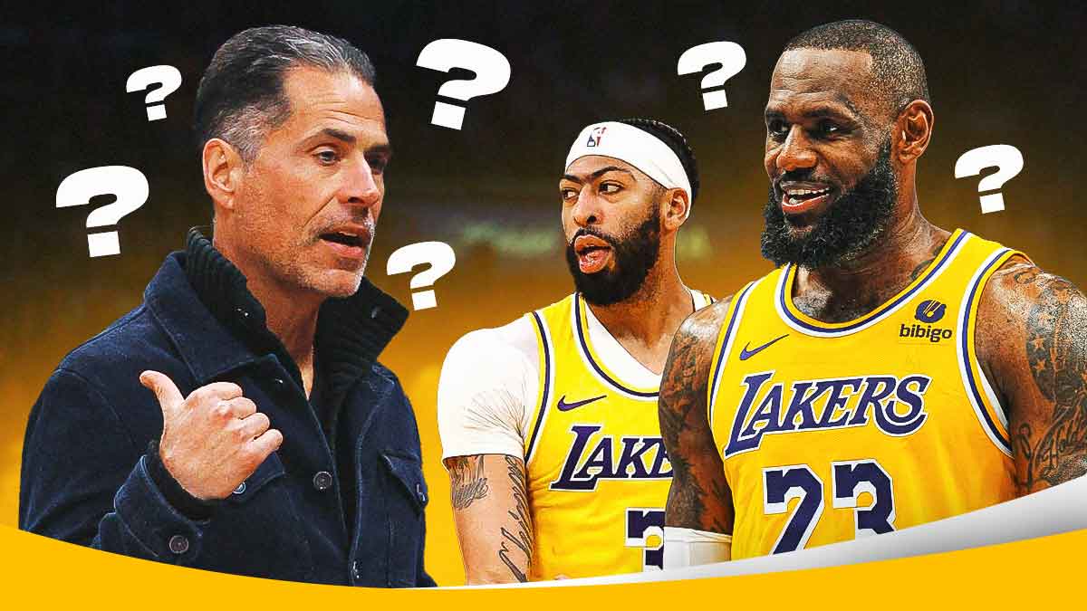 Lakers' Anthony Davis and LeBron James smiling at Rob Pelinka, question marks all over them