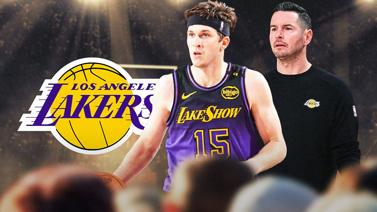 JJ Redick looking at Austin Reaves, Lakers logo in the background.