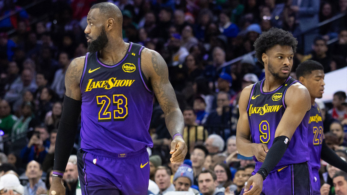 Lakers forward LeBron James (23) and guard Bronny James (9) look on during the third quarter against the Philadelphia 76ers at Wells Fargo Center