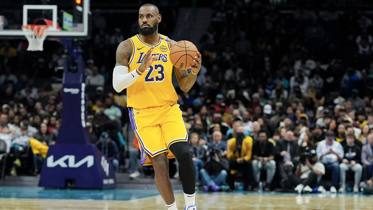 Los Angeles Lakers forward LeBron James (23) brings the ball up court against the Charlotte Hornets during the first quarter at the Spectrum Center.