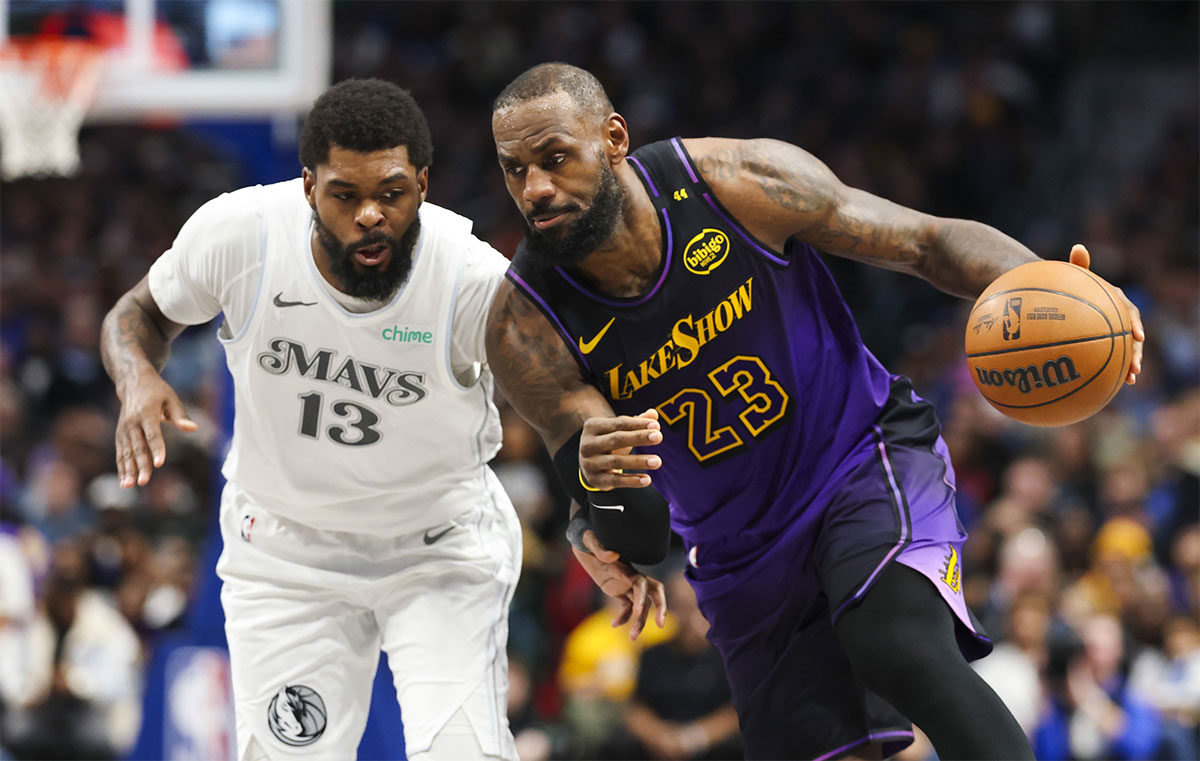 Los Angeles Lakers forward LeBron James (23) drives to the basket as Dallas Mavericks forward Najib Marshall (13) defends during the second half at American Airlines Center.