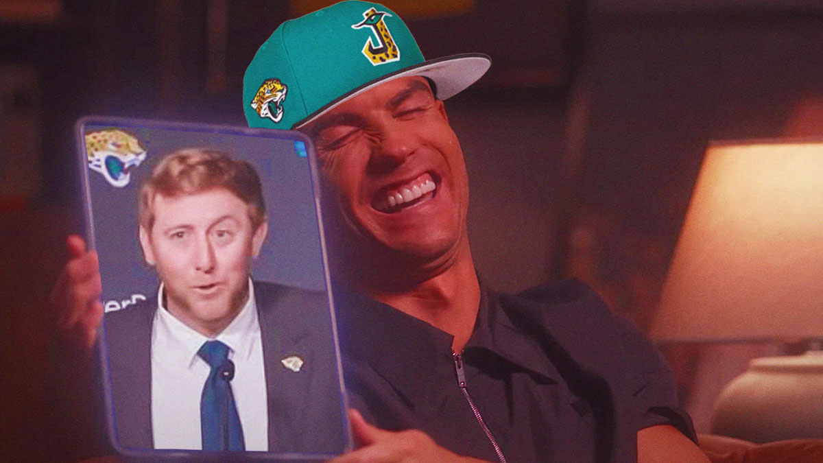Jaguars fan holding up tablet showing off new HC Liam Coen in his viral 'Duval' moment.