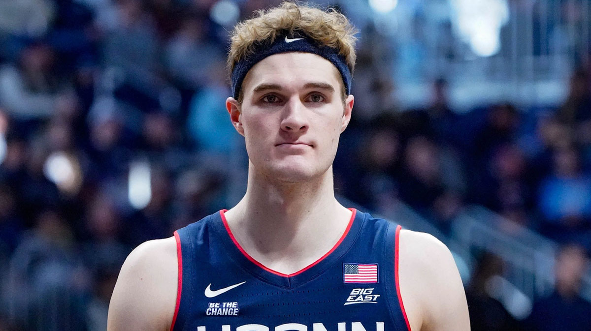 University of Connecticut’s Liam McNeeley (30) celebrates a basket during game between the Butler Bulldogs and the University of Connecticut Husks at Hinkle Fieldhouse on Saturday, Dec. 21, 2024, in Indianapolis.