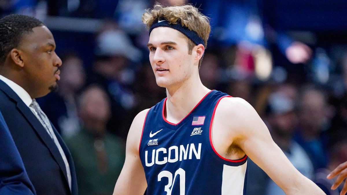 Liam McNeeley (30) celebrates a basket during game between the Butler Bulldogs and the University of Connecticut Husks at Hinkle Fieldhouse on Saturday, Dec. 21, 2024, in Indianapolis.