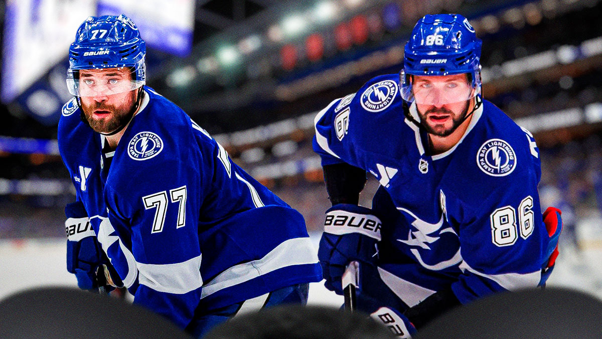 Tampa Bay Lightning winger Nikita Kucherov shooting/passing the puck on right side, Tampa Bay Lightning defensemen Victor Hedman shooting/passing the puck on left side, Amalie Arena (home arena of the Tampa Bay Lightning) in background