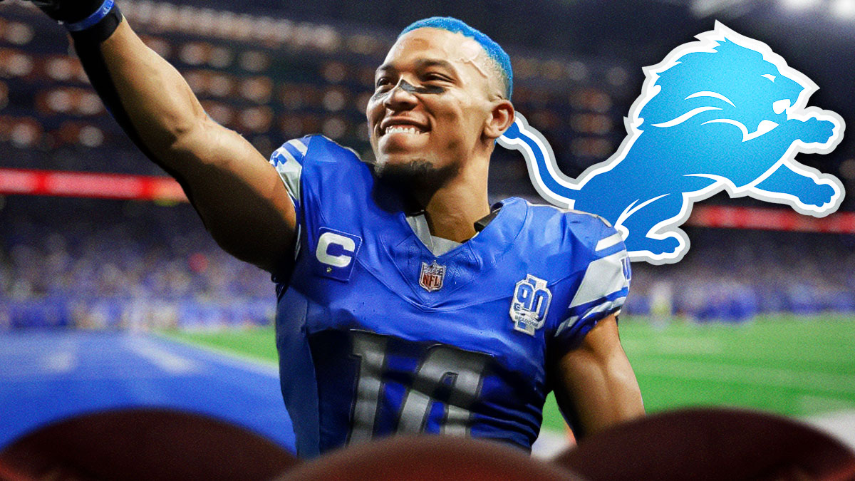 Detroit Lions WR Amon-Ra St. Brown with blue hair. There is also a logo for the Detroit Lions.