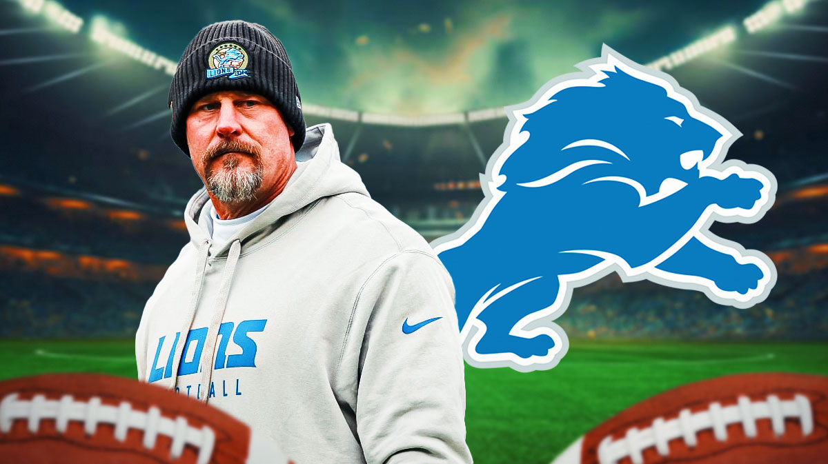 Dan Campbell next to a Lions logo
