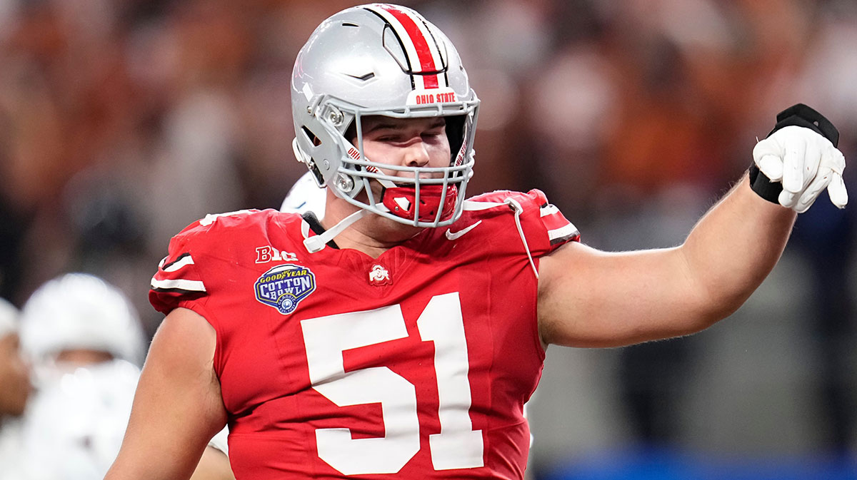 Ohio State Buckeyes offensive lineman Luke Montgomery (51) makes the horns down gesture during the second half of the Cotton Bowl Classic College Football Playoff semifinal game against the Texas Longhorns