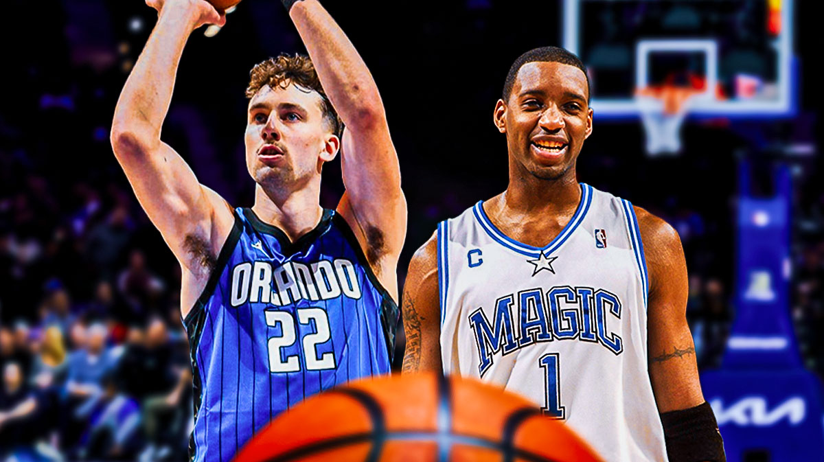 Magic Franz Wagner shooting a basketball with Magic Tracy McGrady