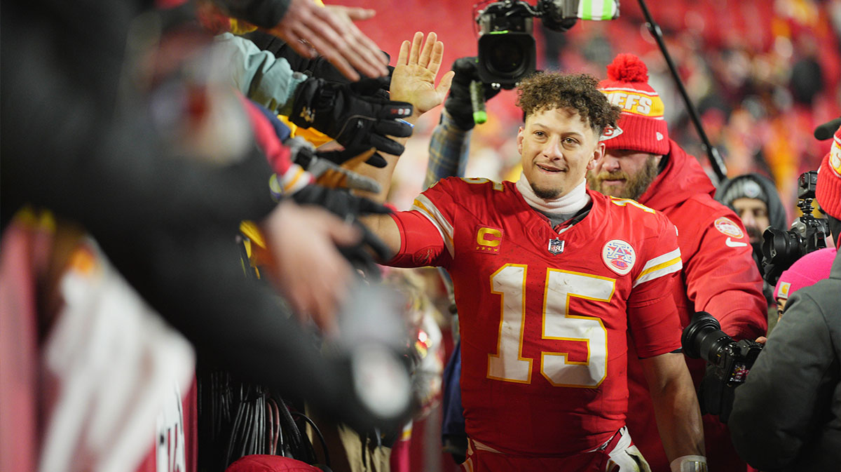     Kansas City Chiefs quarterback Patrick Mahomes (15) shakes hands with fans after defeating the Houston Texans in the 2025 AFC Divisional Round game at GEHA Field at Arrowhead Stadium