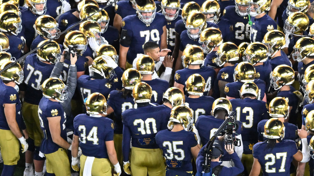 Notre Dame Fighting Irish head coach Marcus Freeman talks to his team before a game against the Florida State Seminoles at Notre Dame Stadium.