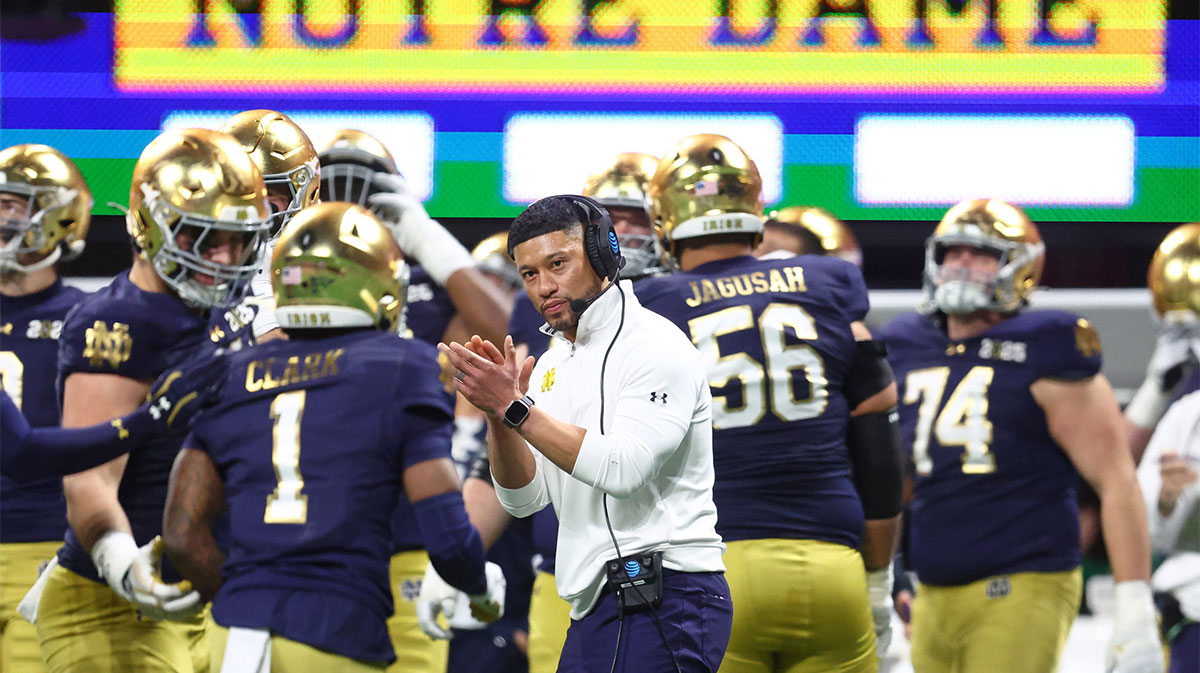 Notre Dame Fighting Irish head coach Marcus Freeman reacts after a play against the Ohio State Buckeyes during the second half the CFP National Championship college football game at Mercedes-Benz Stadium.