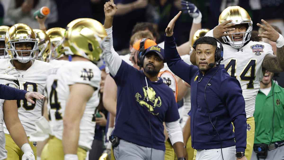 Notre Dame Fighting Irish head coach Marcus Freeman celebrates on the sidelines in the final minute against the Georgia Bulldogs during the fourth quarter at Caesars Superdome
