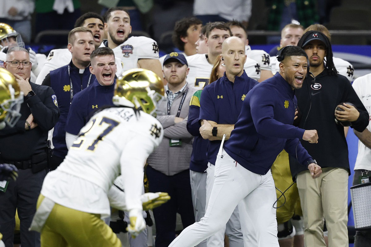Notre Dame Fighting Irish head coach Marcus Freeman (R) reacts on the sidelines in the final minute against the Georgia Bulldogs during the fourth quarter at Caesars Superdome.