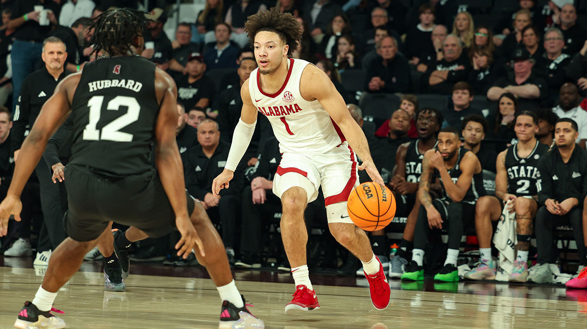 Alabama Crimson Tide guard Mark Sears (1) looks to pass the ball as Mississippi State Bulldogs guard Josh Hubbard (12) defends during the first half at Humphrey Coliseum.