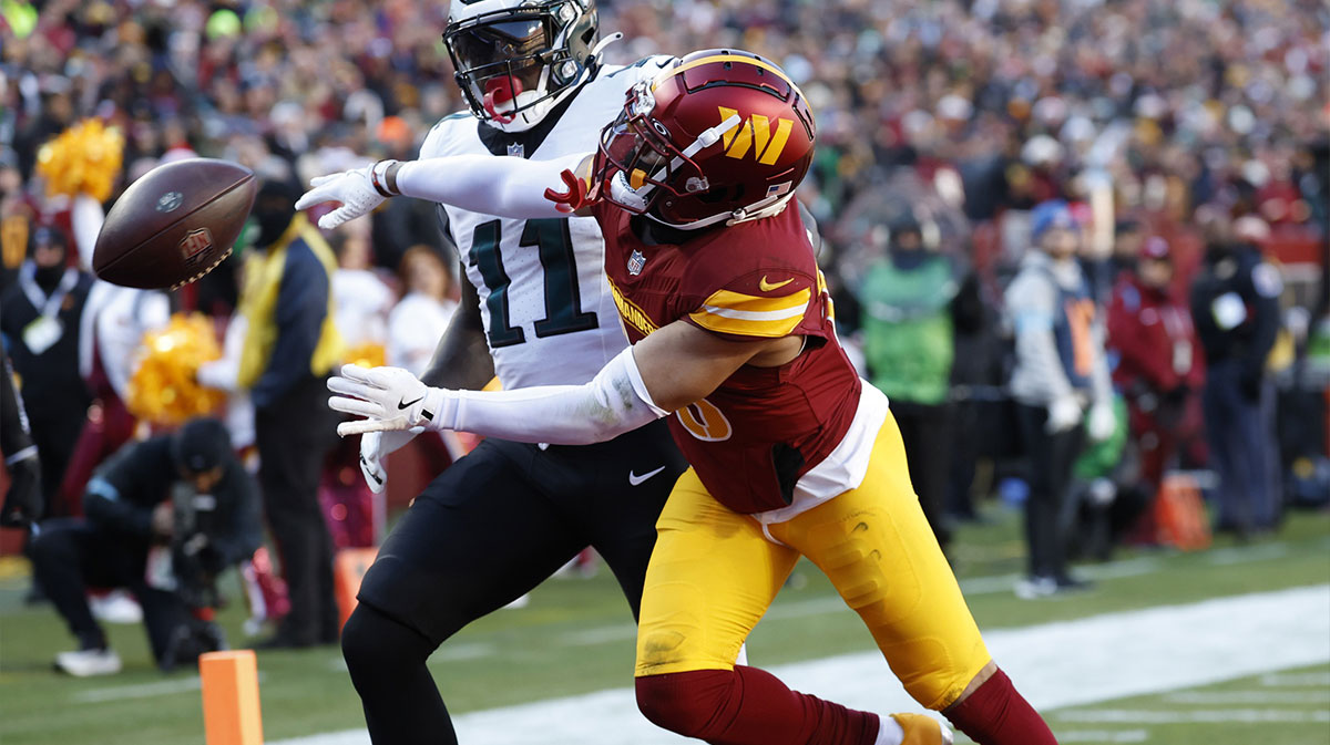 Dec 22, 2024; Landover, Maryland, USA; Washington Commanders cornerback Marshon Lattimore (23) defends a pass intended for Philadelphia Eagles wide receiver A.J. Brown (11) during the first quarter at Northwest Stadium.