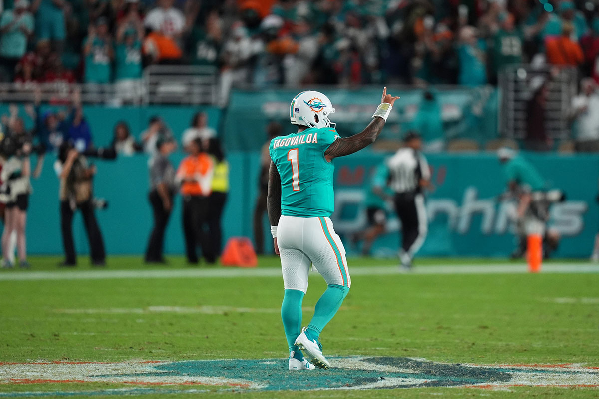 Miami Dolphins quarterback Tua Tagovailoa (1) celebrates the touchdown of running back De'Von Achane (28, not pictured) during second half against the San Francisco 49ers at Hard Rock Stadium. 