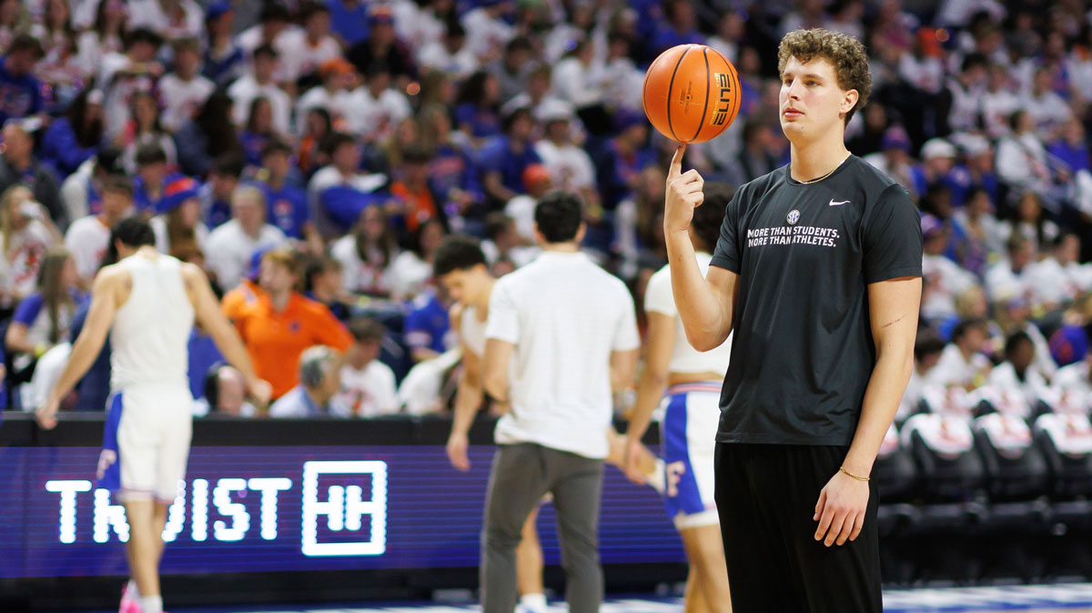 Florida Gators center Micah Handlogten (3) spins a ball on his finger before a game against the Georgia Bulldogs at Exactech Arena at the Stephen C. O'Connell Center.