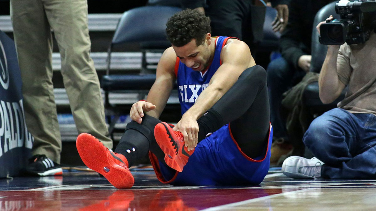 Philadelphia 76ers guard Michael Carter-Williams (1) reacts after injuring himself in the third quarter of their game against the Atlanta Hawks at Philips Arena. The Hawks won 91-85. 