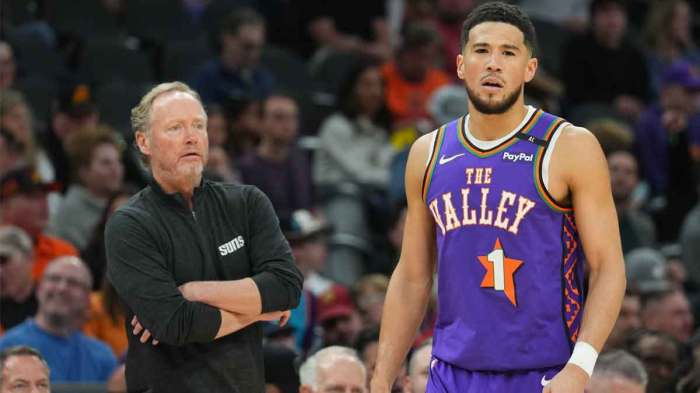 Phoenix Suns head coach Mike Budenholzer looks on alongside Phoenix Suns guard Devin Booker (1) against the Utah Jazz during the first half at Footprint Center.