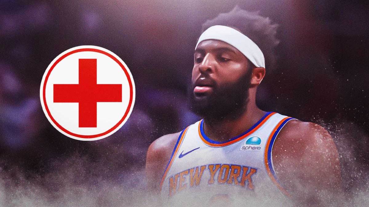 Knicks' Mitchell Robinson with medical Red Cross symbol
