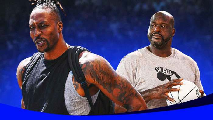 Shaq looking angry at Dwight Howard, both are in street clothes.