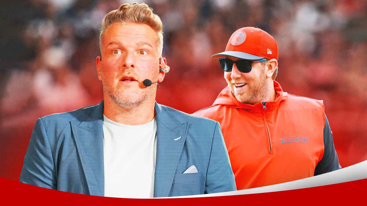 Pat McAfee with shocked face standing next to Buccaneers OC and Jaguars head coach candidate Liam Coen. Background is football field.