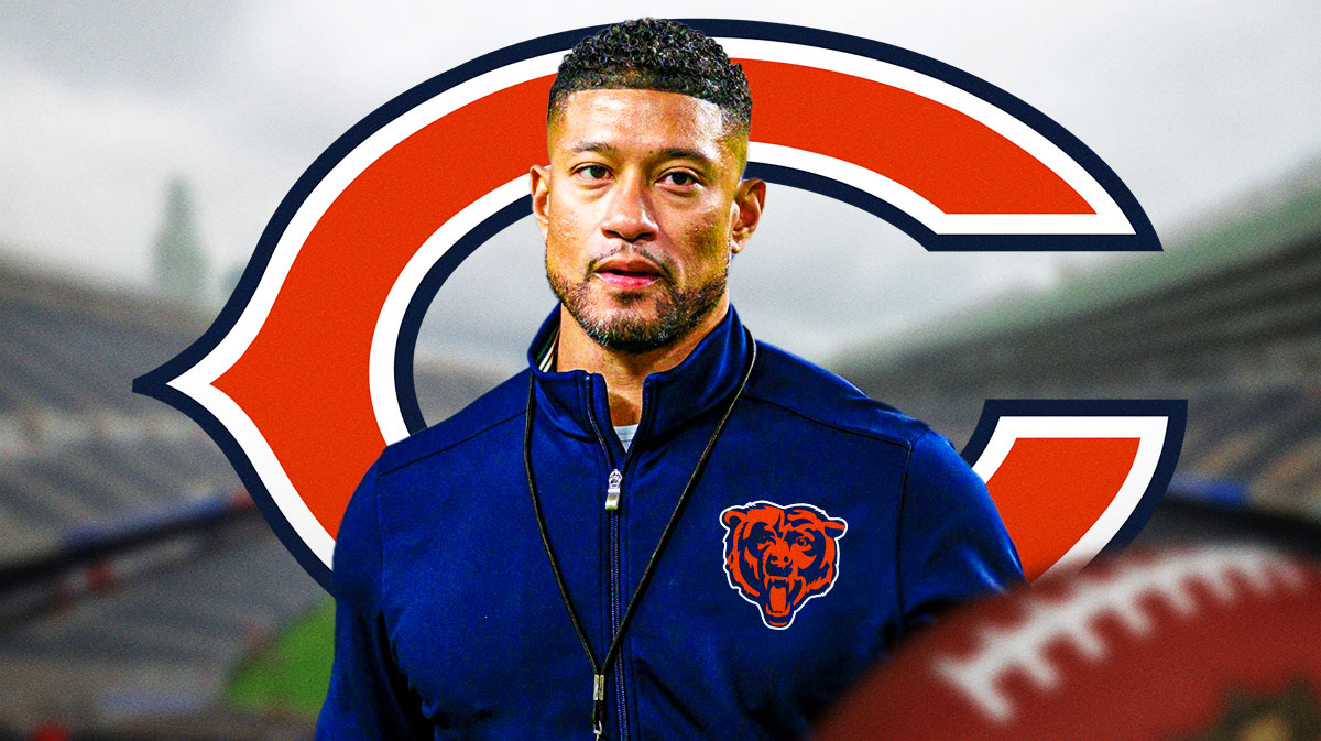 Marcus Freeman wearing Bears gear in front of a Bears logo