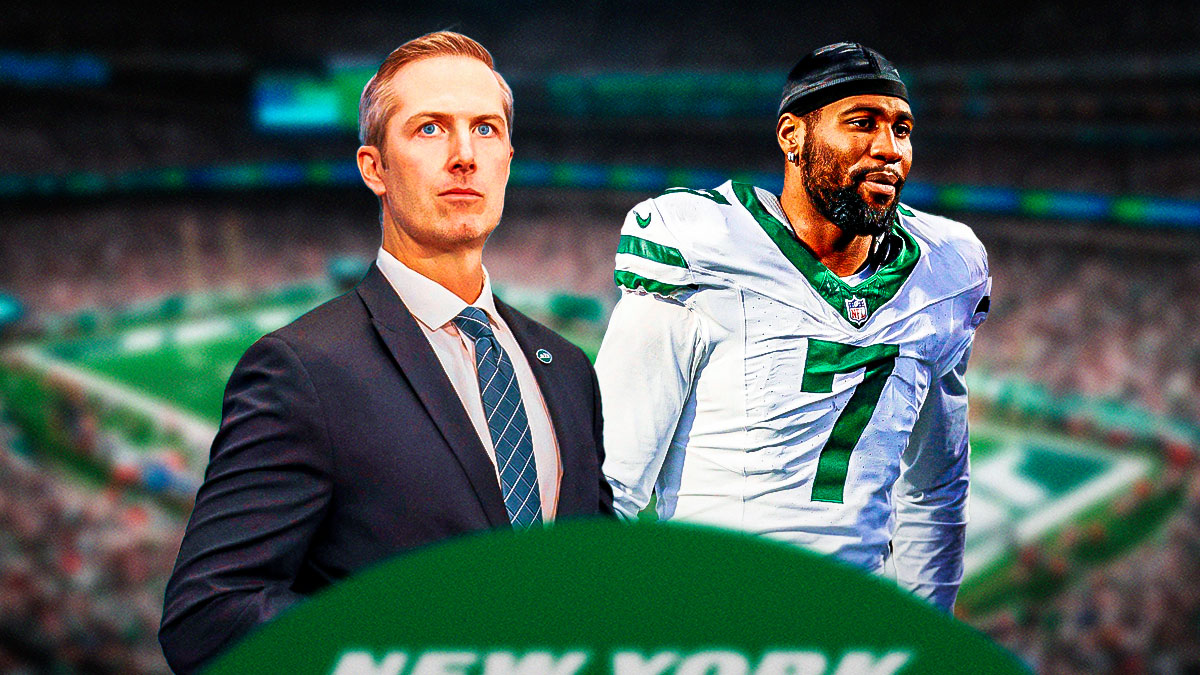 Jets Darren Mougey with Jets Haason Reddick behind him looking down