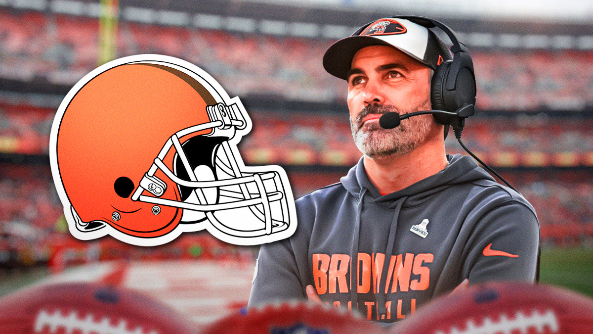 Cleveland Browns head coach Kevin Stefanski with a logo for the Cleveland Browns.