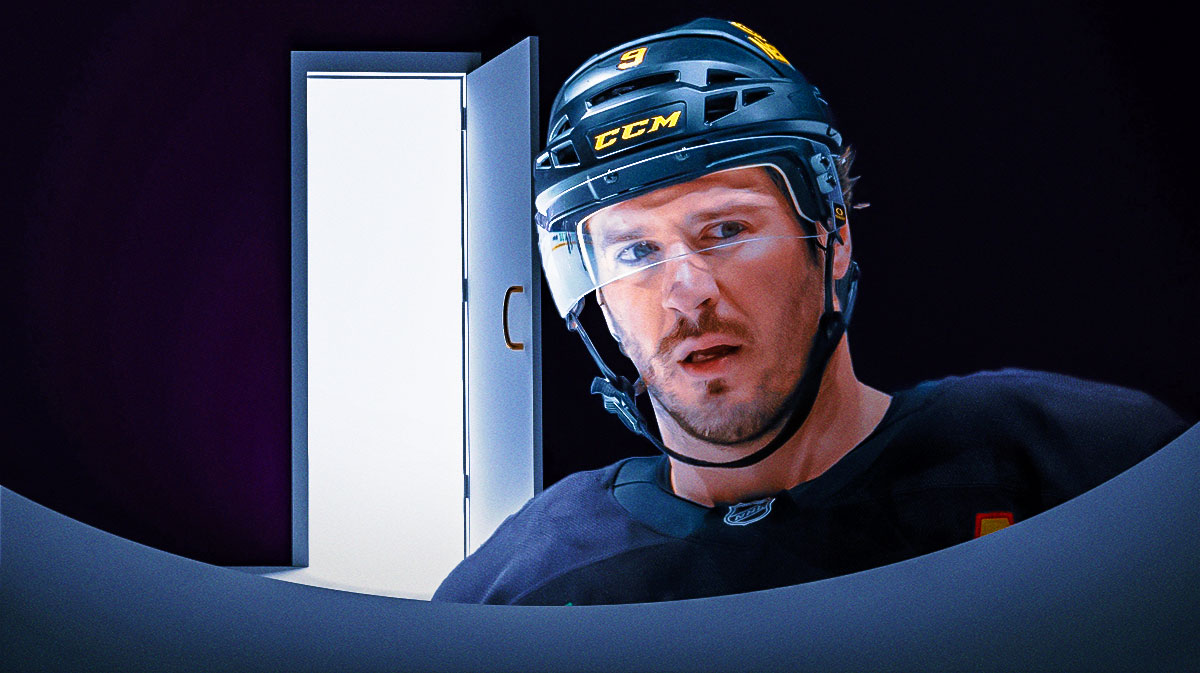 Photo: JT Miller in Canucks jersey looking serious, open door behind him