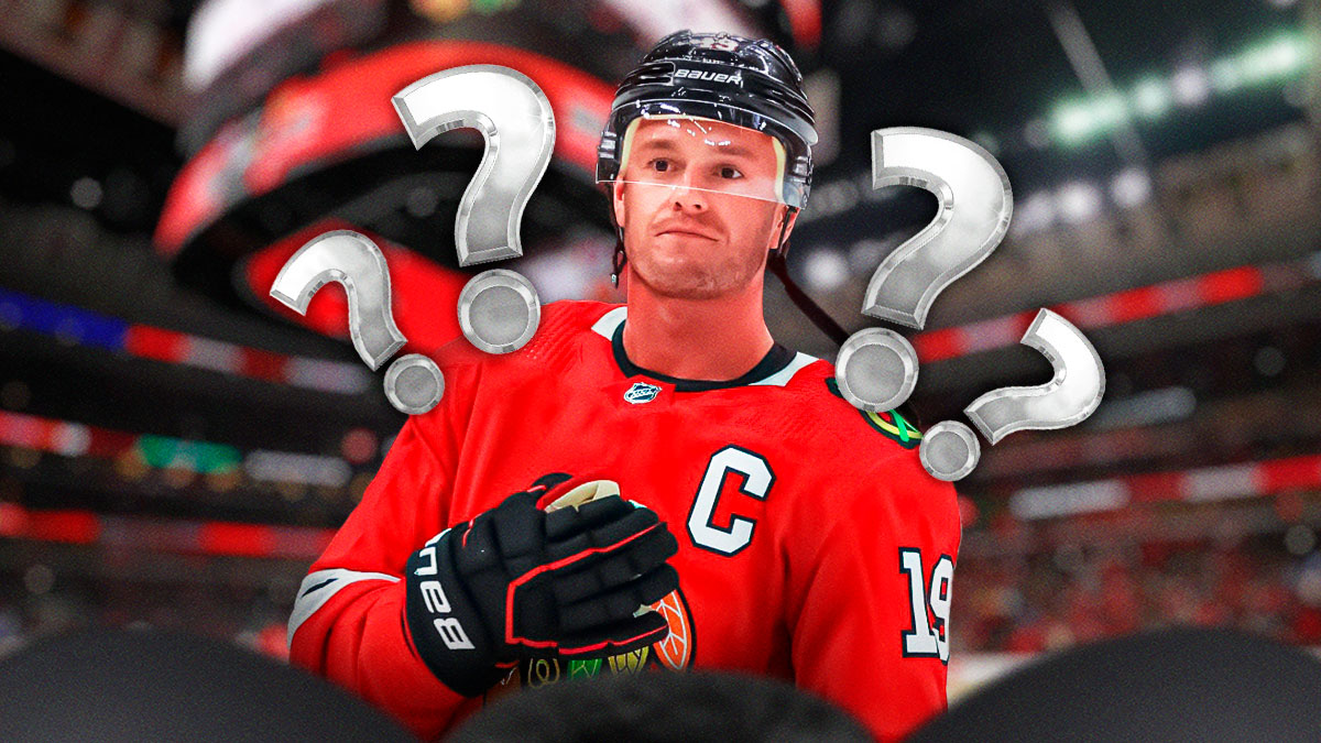 Jonathan Toews looking stern, 3-5 question marks, hockey rink in background