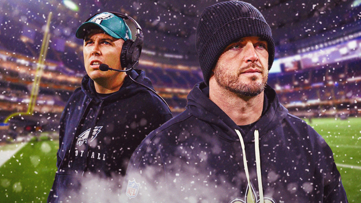 Kellen Moore is next to Derek Carr in front of the Saints stadium with snowflakes around it.