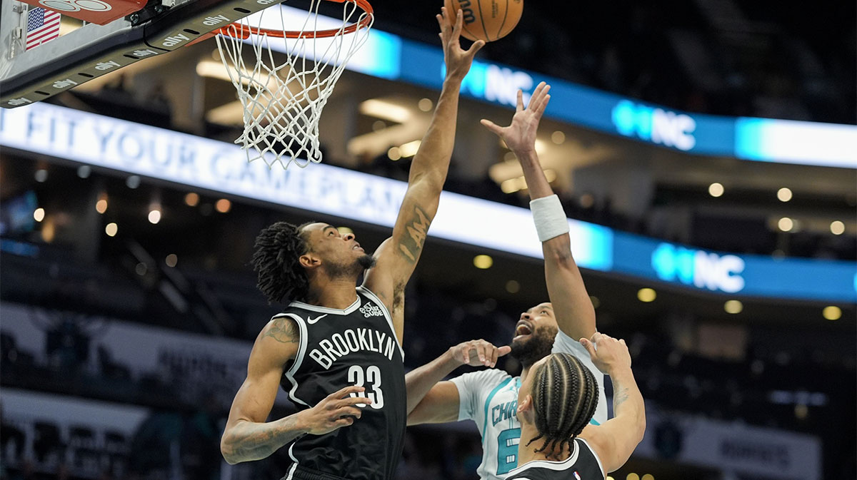 Brookline Nets Center NIC Claxton (33) Blocks Charlotte Hornets forward This Gibson (67) during the second half in Center Spectrum.