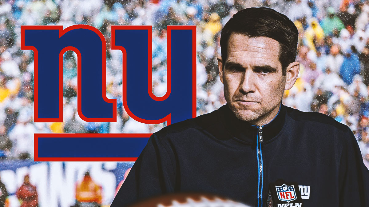 Joe Schoen looking stern, New York Giants logo, football field in background