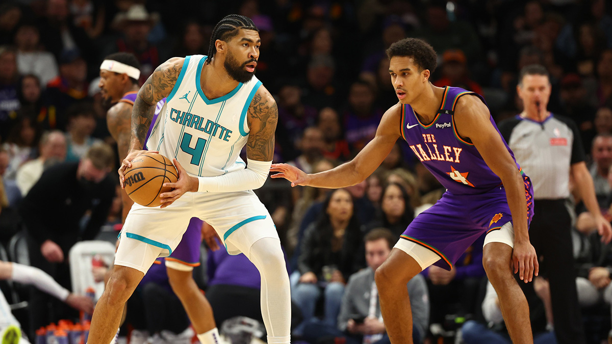 Charlotte Hornets center Nick Richards (left) against Phoenix Suns center Osa Ighodaro at the Footprint Center. 