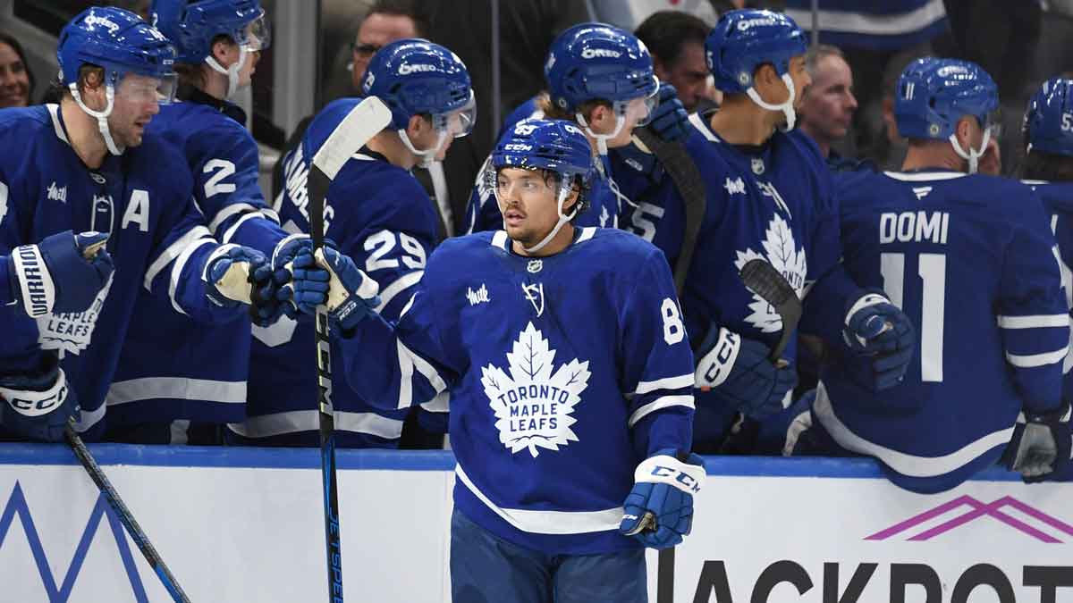 Toronto Maple Leafs forward Nick Robertson (89) celebrates with teammates on the bench after scoring a goal against the Montreal Canadiens in the second period at Scotiabank Arena.